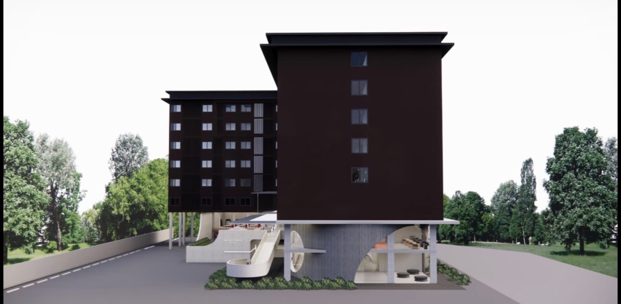 Three-quarter view of the hotel with its sweeping entry ramp